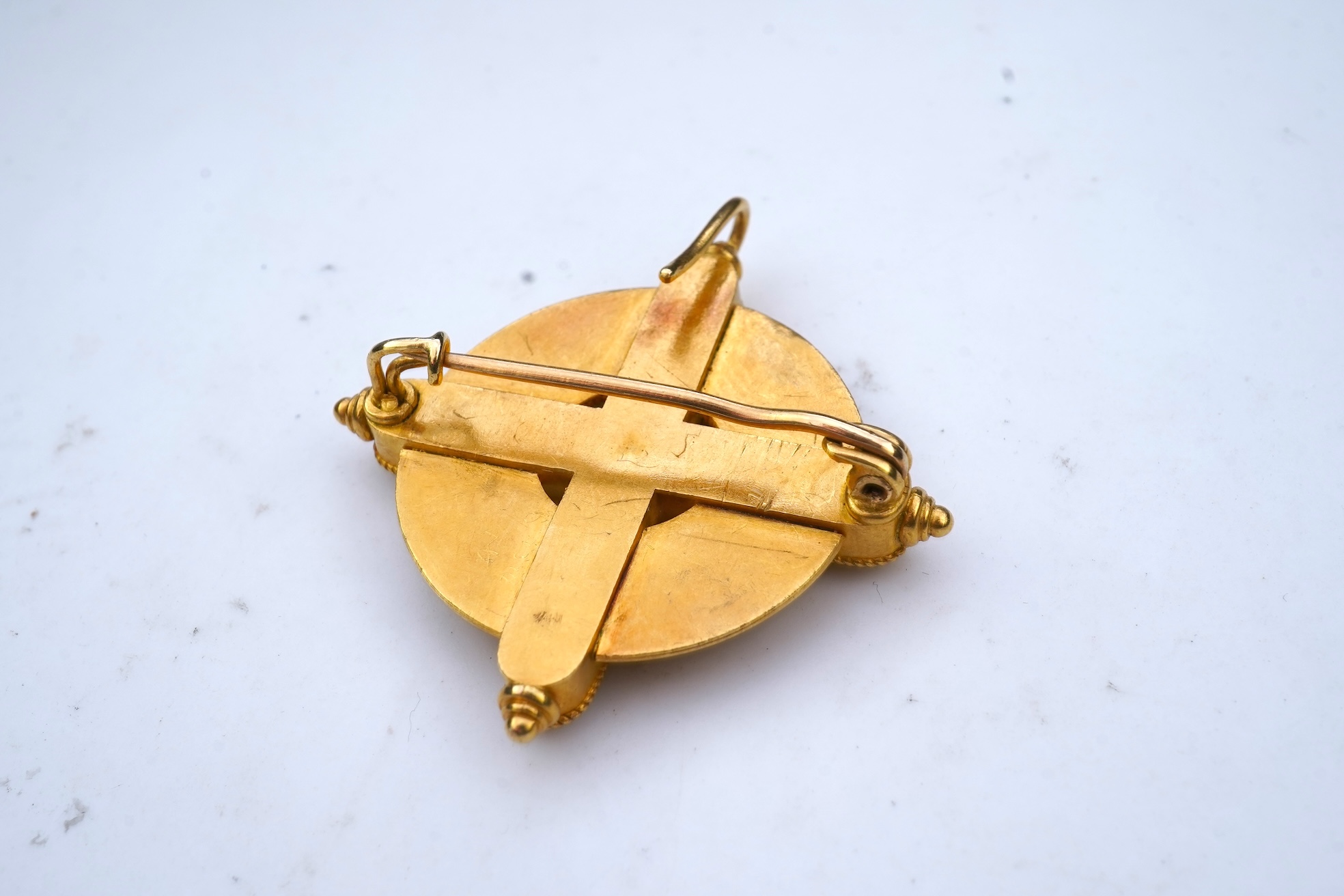 A gold, enamel and pearl pendant/brooch, mid 19th century, and a pair of earrings
